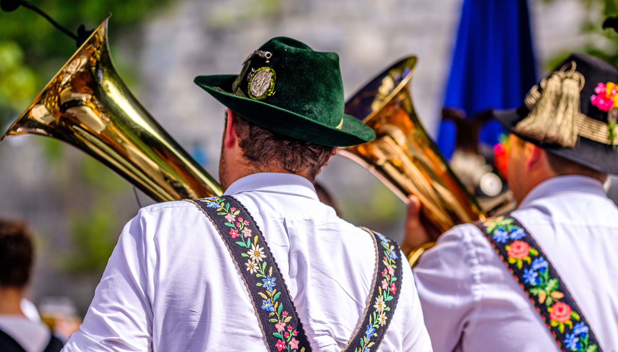 Brass band musicians in traditional costume with tubas